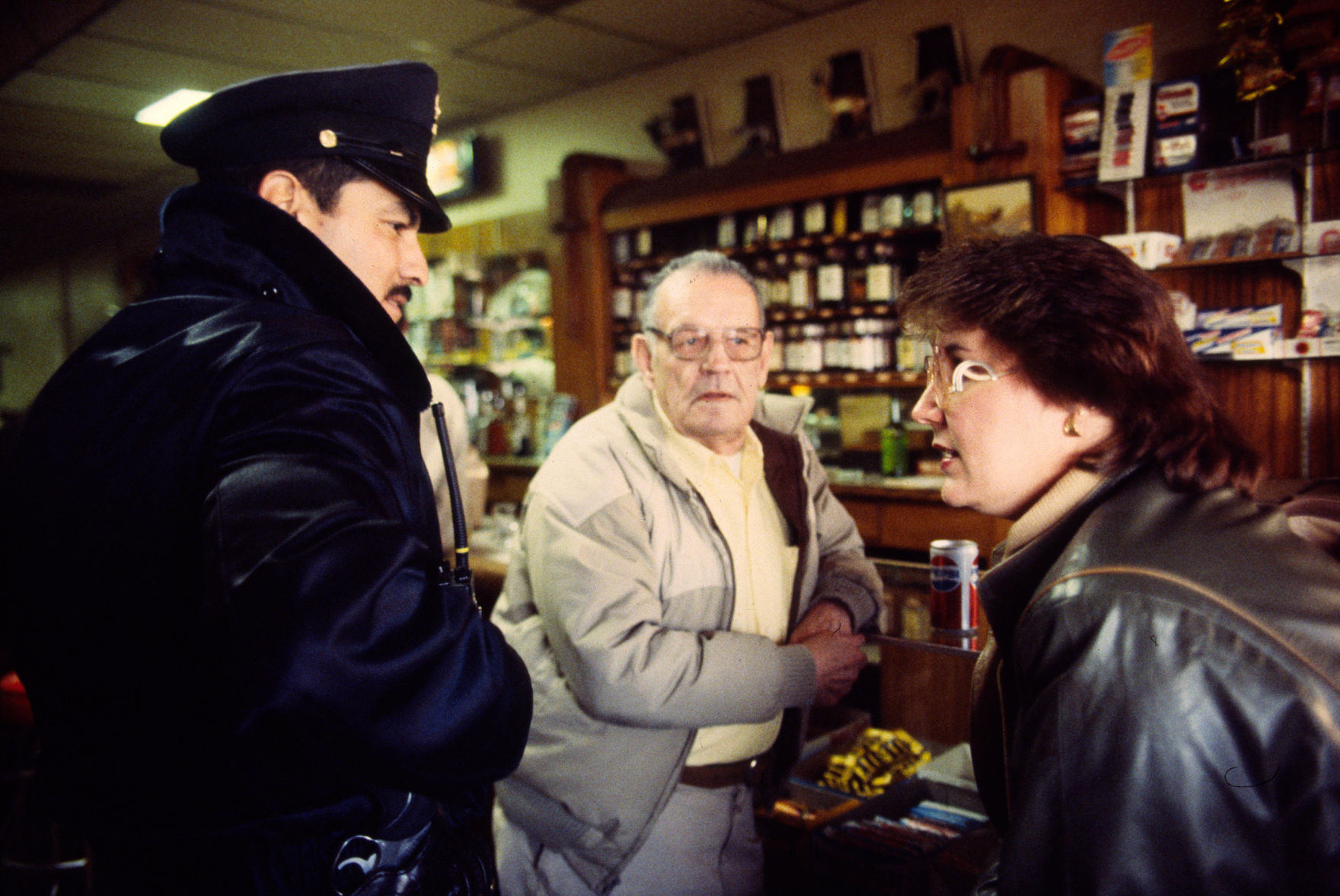 Billings police officer at a downtown business, 1984
